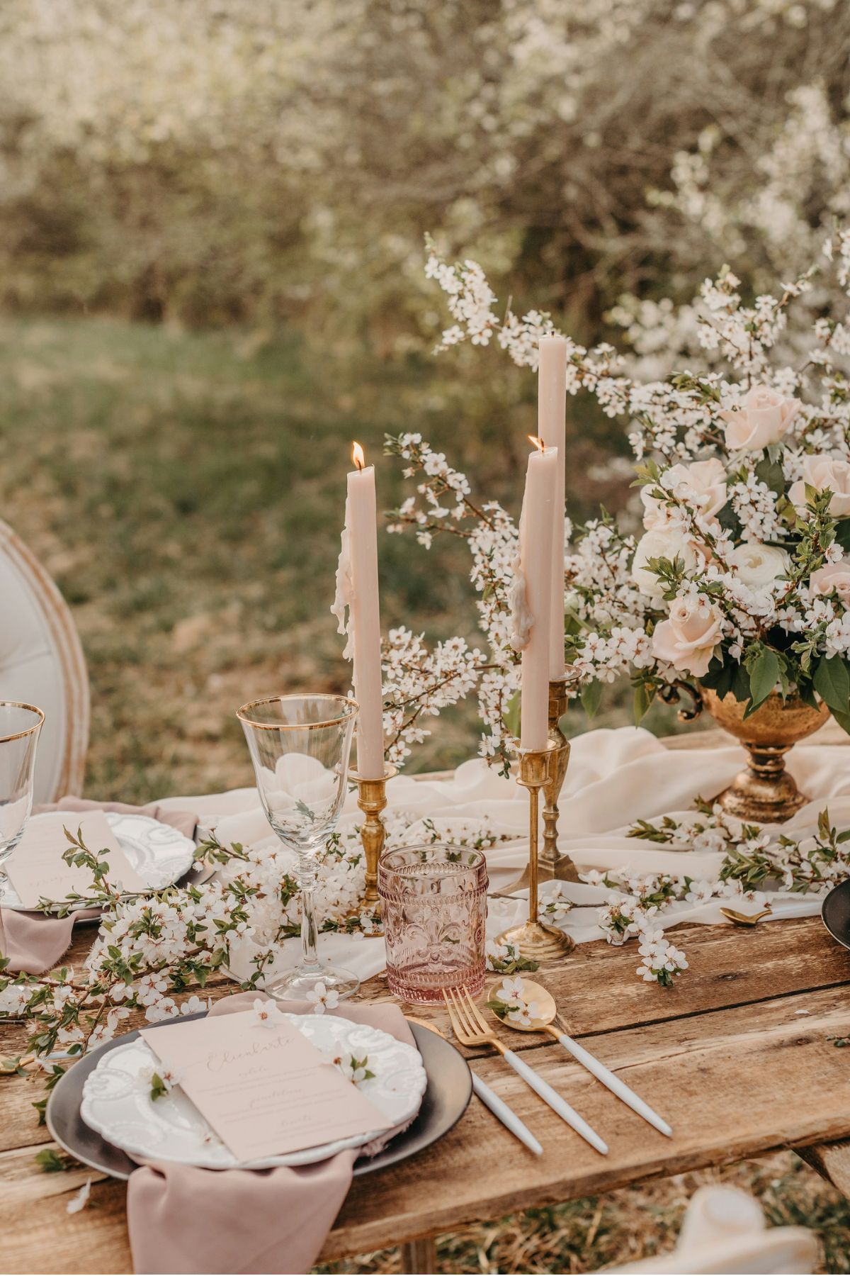 Wedding table with cherry blossoms and candlelight